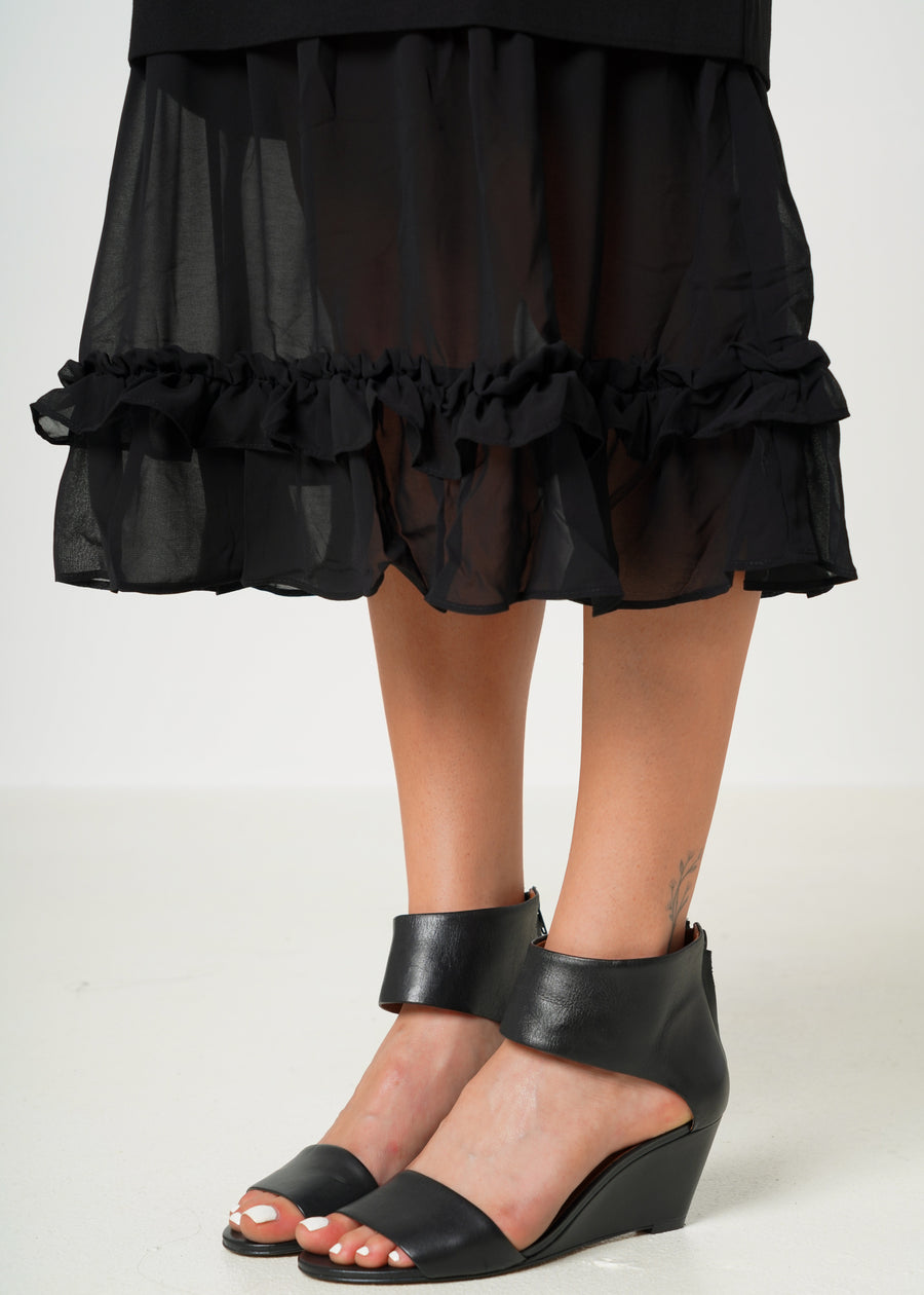 Vestido a media pierna con dobladillo con volantes en contraste transparente en negro