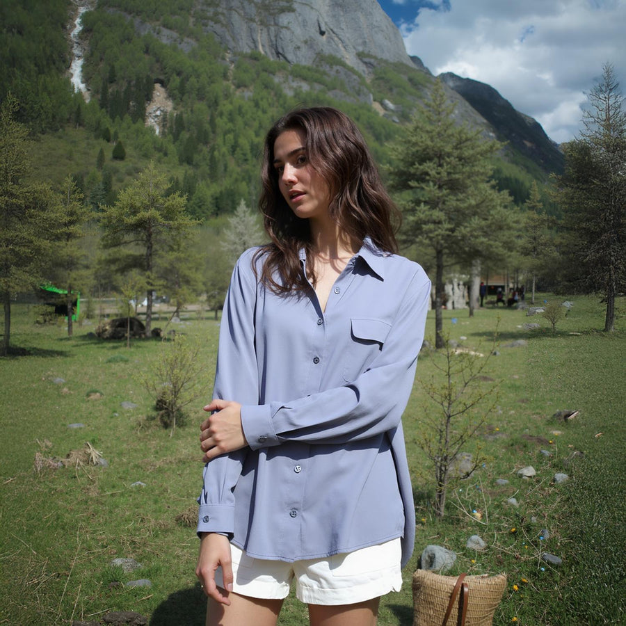 Pleione Women's Solid Low Back Button Shirt in Dusty Blue - shopatkonus